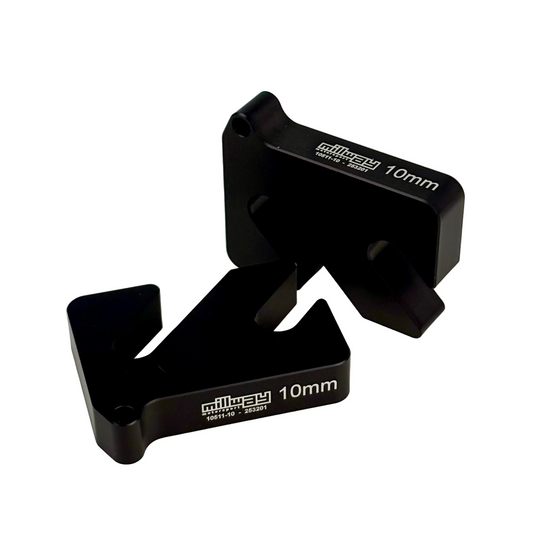 Black camber shims on a white background