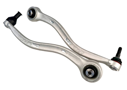 Two metal control arms on a white background