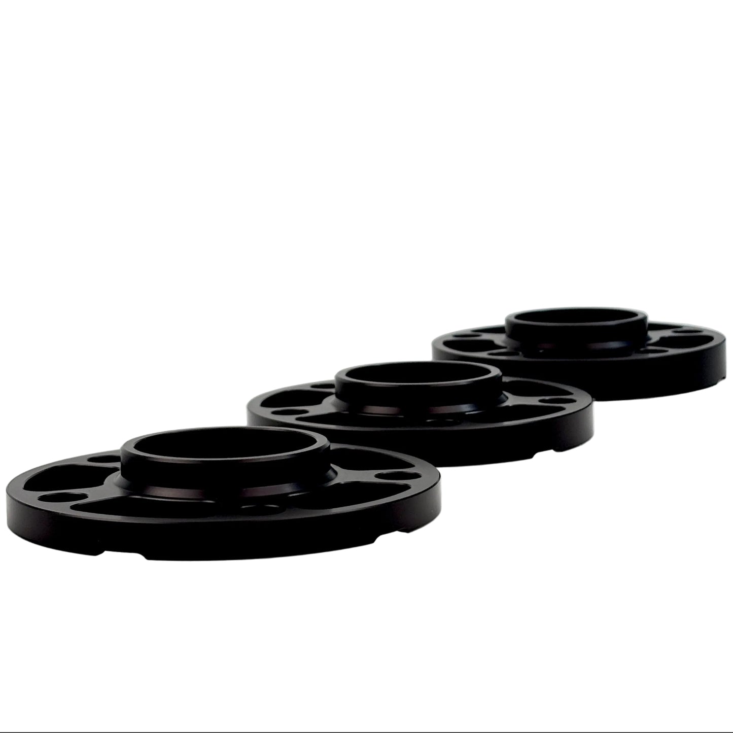 Black spacers on white background. Millway have 12mm,15mm,20mm and 25mm. On this picture you see 12,15 and 20mm.