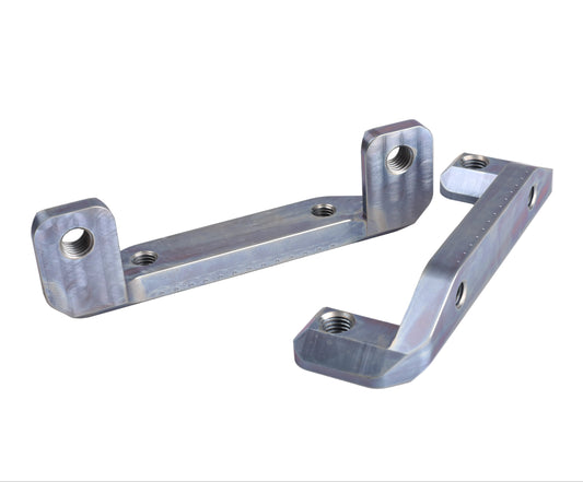 Two metallic silver anodized aluminum mounting brackets with threaded holes, displayed on a light beige background.